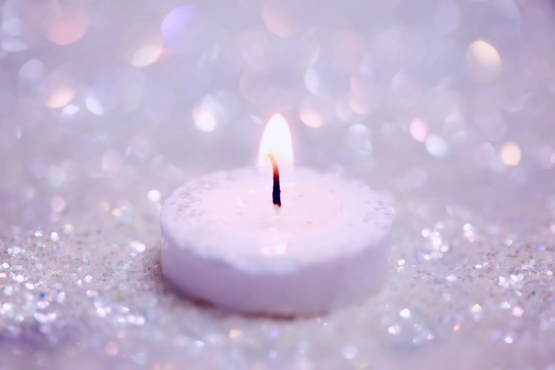 purple candle and sparkles